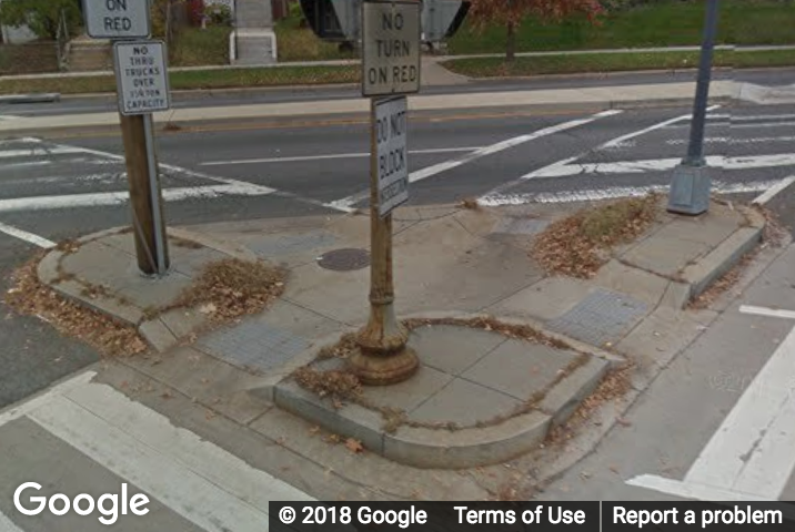 A Street View image of an island that interferes with the crosswalk